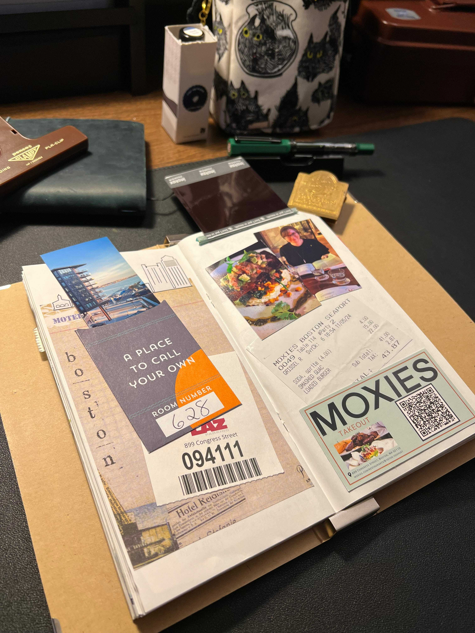 Auto-generated description: A scrapbook page features travel brochures, a hotel key card, a restaurant receipt from Moxies, and a photo of a dining experience, all arranged artistically.